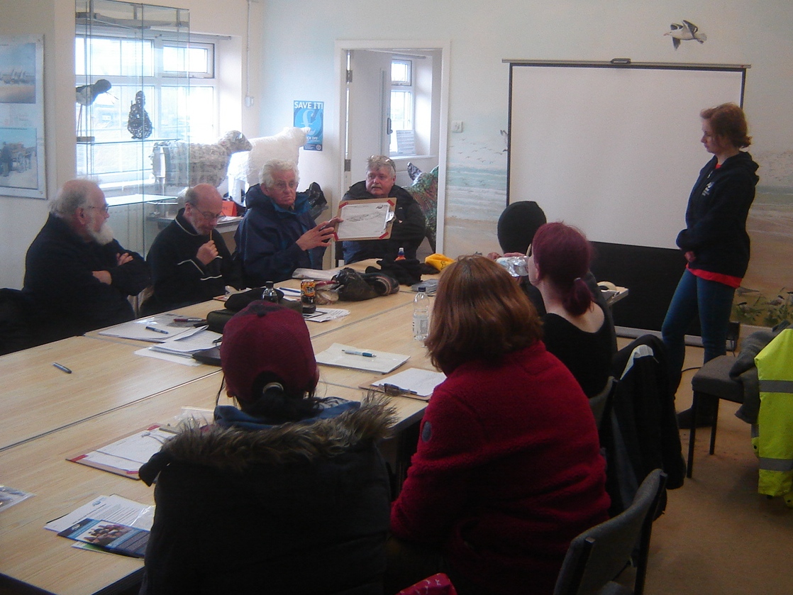 Looking over site sketches in the classroom